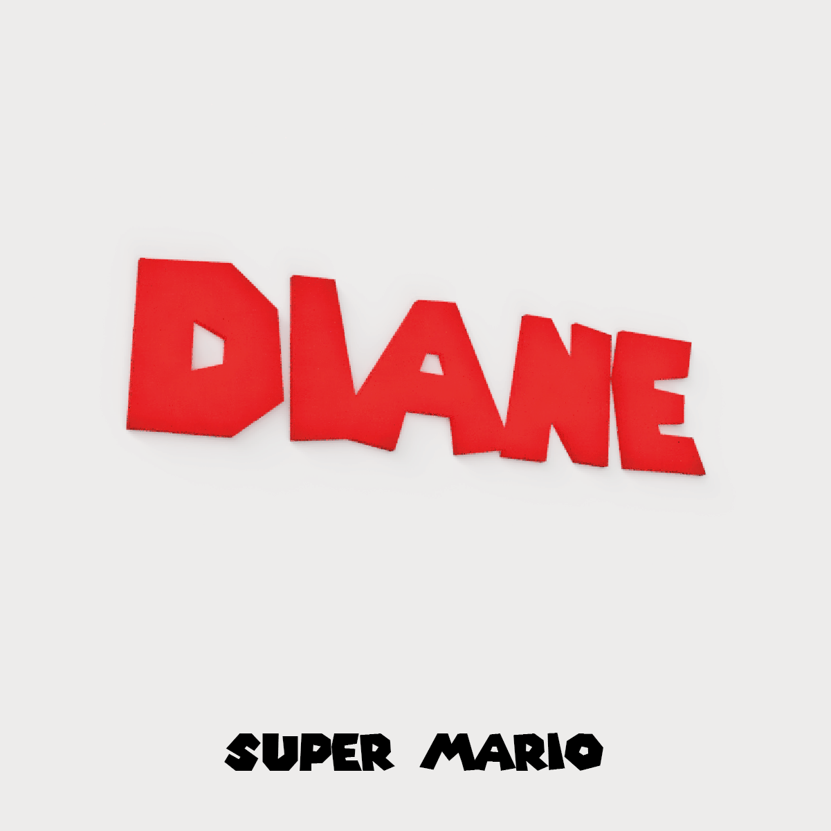 Prénom mural « Diane » en impression 3D rouge, style Super Mario, sur fond gris clair.